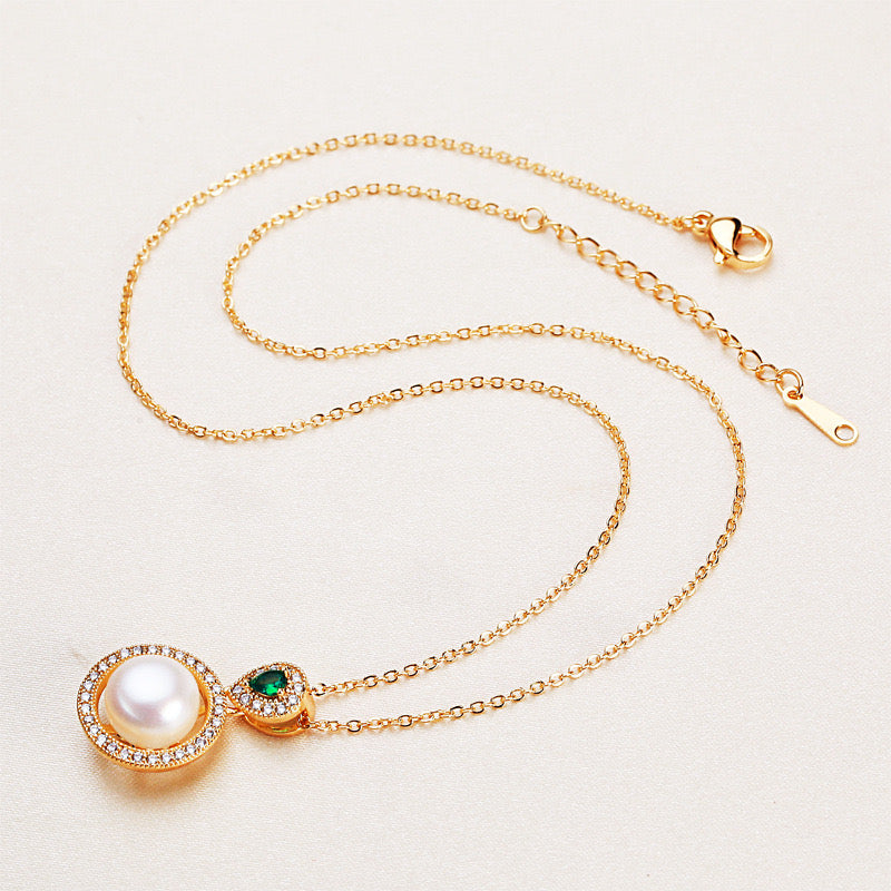 A brass plated necklace with cultured order pearls.